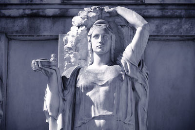 Low angle view of statue against building