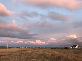 Scenic view of field against sky during sunset