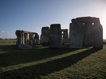 Built structure on field against sky