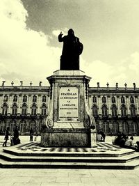 Low angle view of statue against cloudy sky