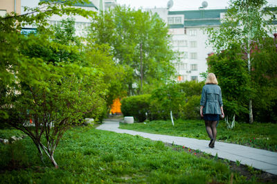 Rear view of woman walking in park