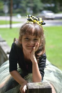 Portrait of girl leaning on railing