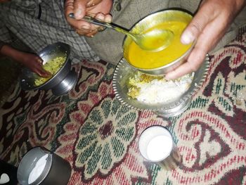 Midsection of man preparing food on table