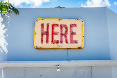 Close-up of warning sign on wall