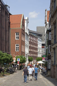 Man walking on road in city