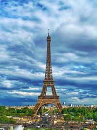 Tower against cloudy sky