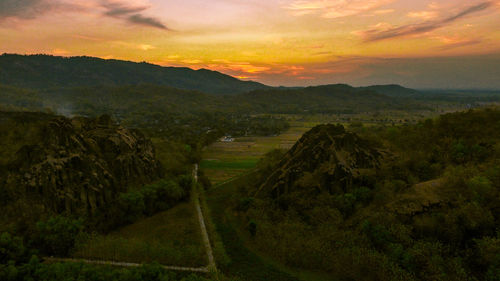 Scenic view of landscape against sky during sunset