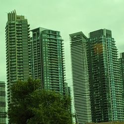 Low angle view of modern buildings against sky