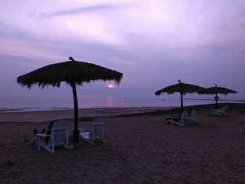 Scenic view of beach against sky during sunset