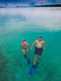 People swimming in sea