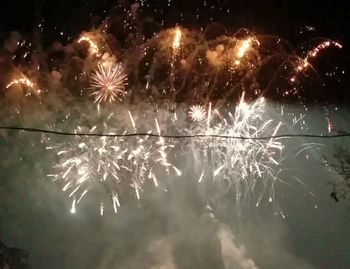 Firework display at night