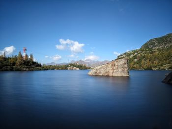 Scenic view of lake against blue sky