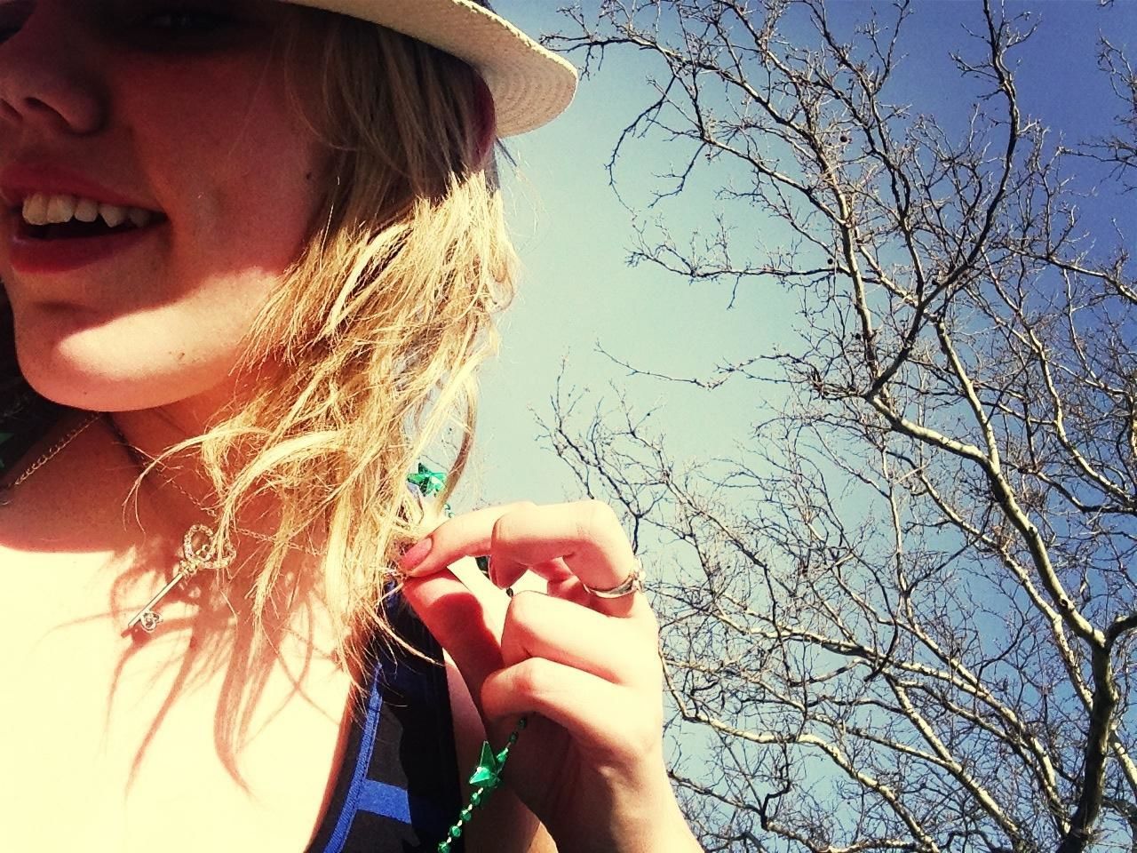 lifestyles, leisure activity, young women, young adult, person, headshot, tree, bare tree, holding, long hair, looking at camera, close-up, branch, front view