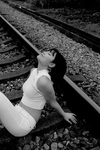 High angle view of woman on railroad track