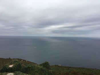 View of calm sea against cloudy sky