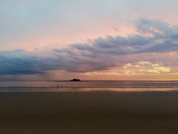 Scenic view of sea against dramatic sky