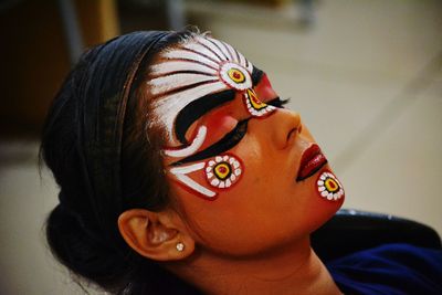 Close-up portrait of boy with toy