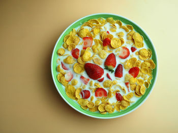 Close-up of fruits in bowl against white background