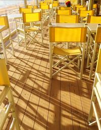 Empty yellow chairs in restaurant