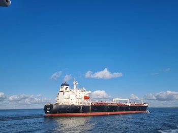 Ship in sea against sky