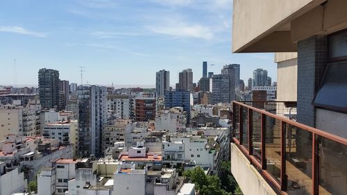 High angle view of buildings in city against sky