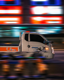 Blurred motion of car on street at night