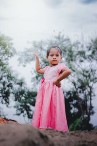 Portrait of cute girl standing outdoors