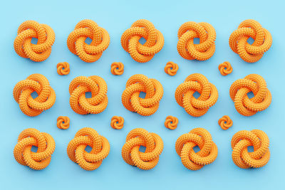 High angle view of orange snack on blue background