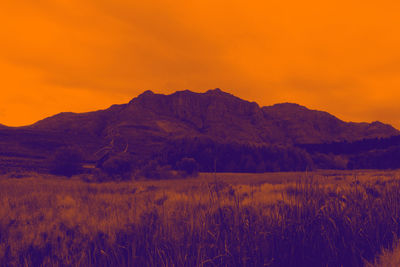 Scenic view of mountains at sunset