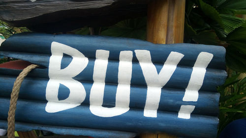 Buy sign on wooden structure