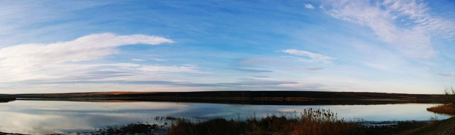 Scenic view of landscape against blue sky