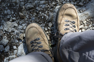Brown hiking shoes in the mountains