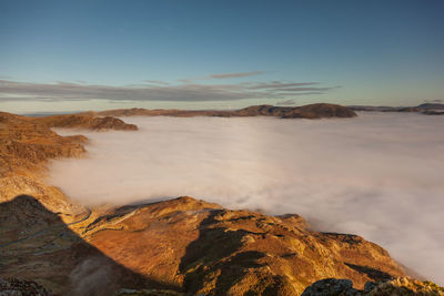 Scenic view of rocks in mountains against sky