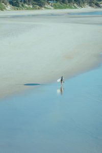 High angle view of man surfing in sea