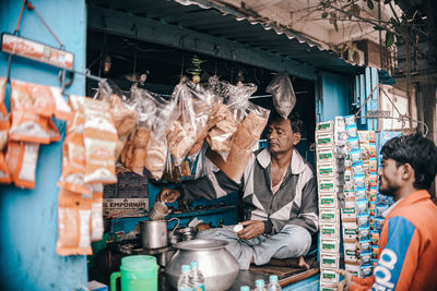 People working at market stall