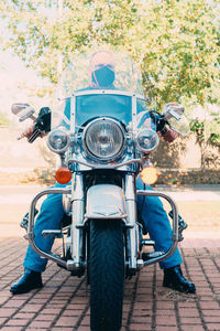 Man riding motor scooter on road