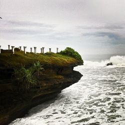 Scenic view of sea against cloudy sky