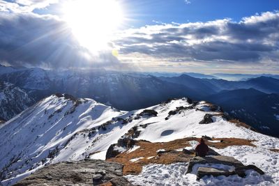 Scenic view of snowcapped mountains against sky