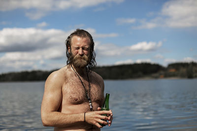 Smiling man at lake