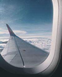 Airplane wing seen through window