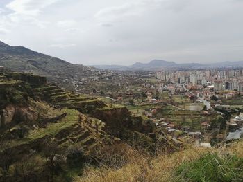 Aerial view of townscape against sky