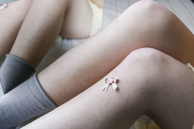 Low section of woman sitting on floor