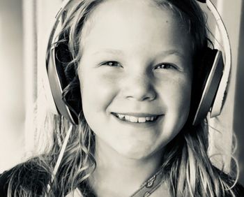 Portrait of cute girl listening music