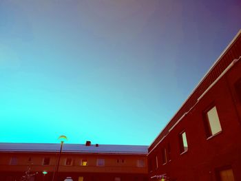 Low angle view of building against blue sky