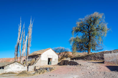 Low angle view of castle against clear blue sky