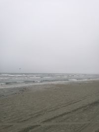 Scenic view of beach against clear sky