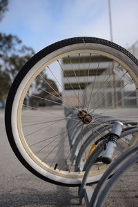 Close-up of bicycle wheel on road