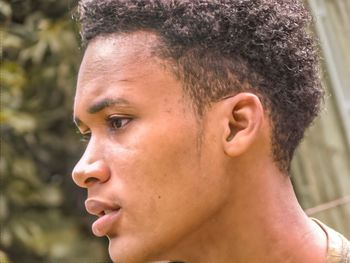 Close-up of young man looking away