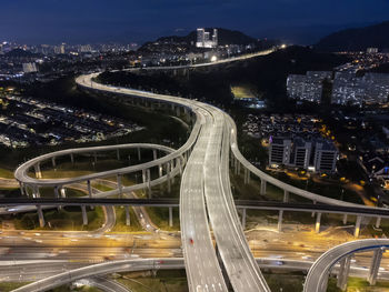 High angle view of illuminated buildings in city at night