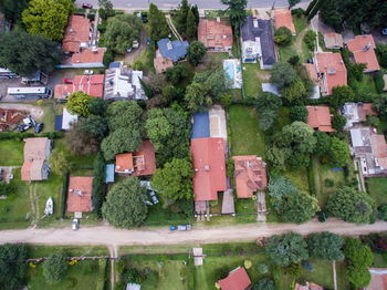 High angle view of buildings by street in town